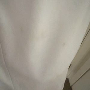 White satin dress with side ruched bejeweled patch.